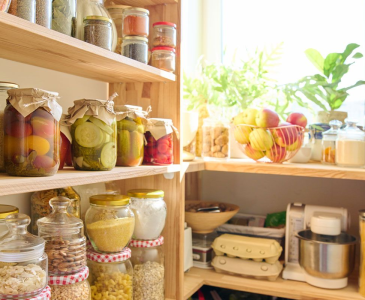 Photo of pantry shelves with canned goods and kitchenn tools.