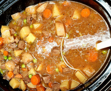 large crockpot full of cooked beef stew.