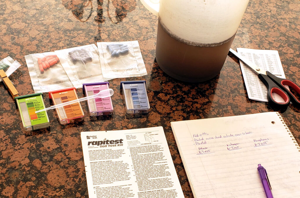 Soil test kit laid out on a kitchen countertop.