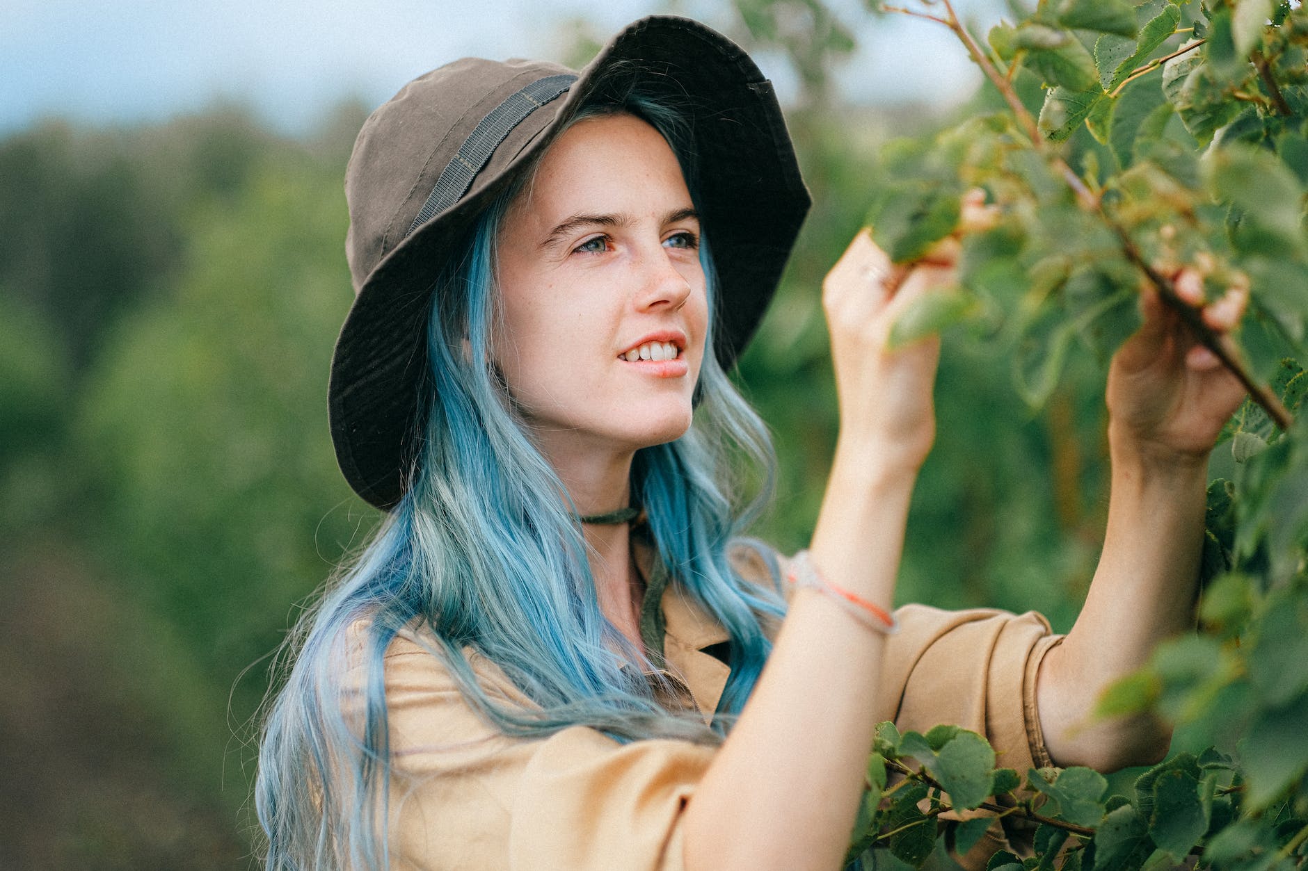 close up shot of a woman touching plants