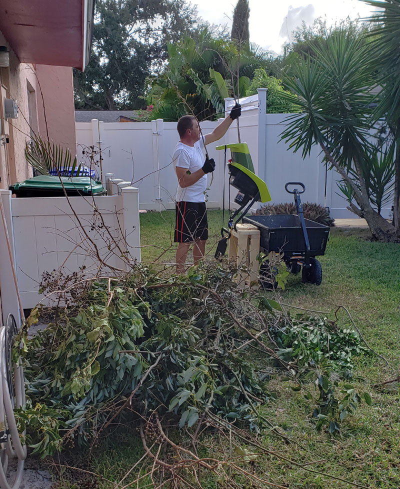 Mike chipping tree branches