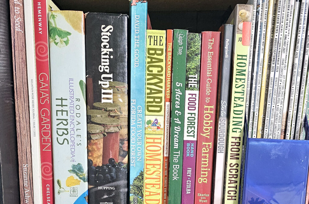 a row of books about homesteading