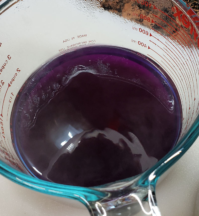 purple cabbage dye in glass measuring cup