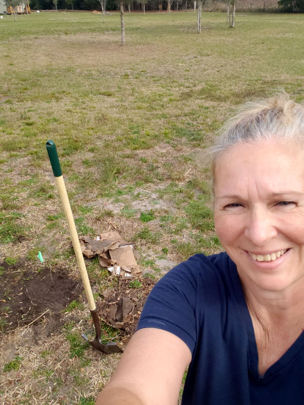 Alisa working in her food forest.