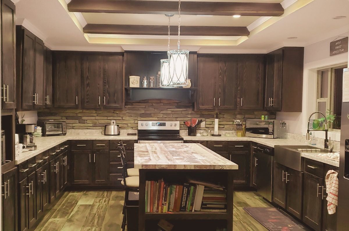 Large farmhouse styled open kitchen with a large island in the middle.