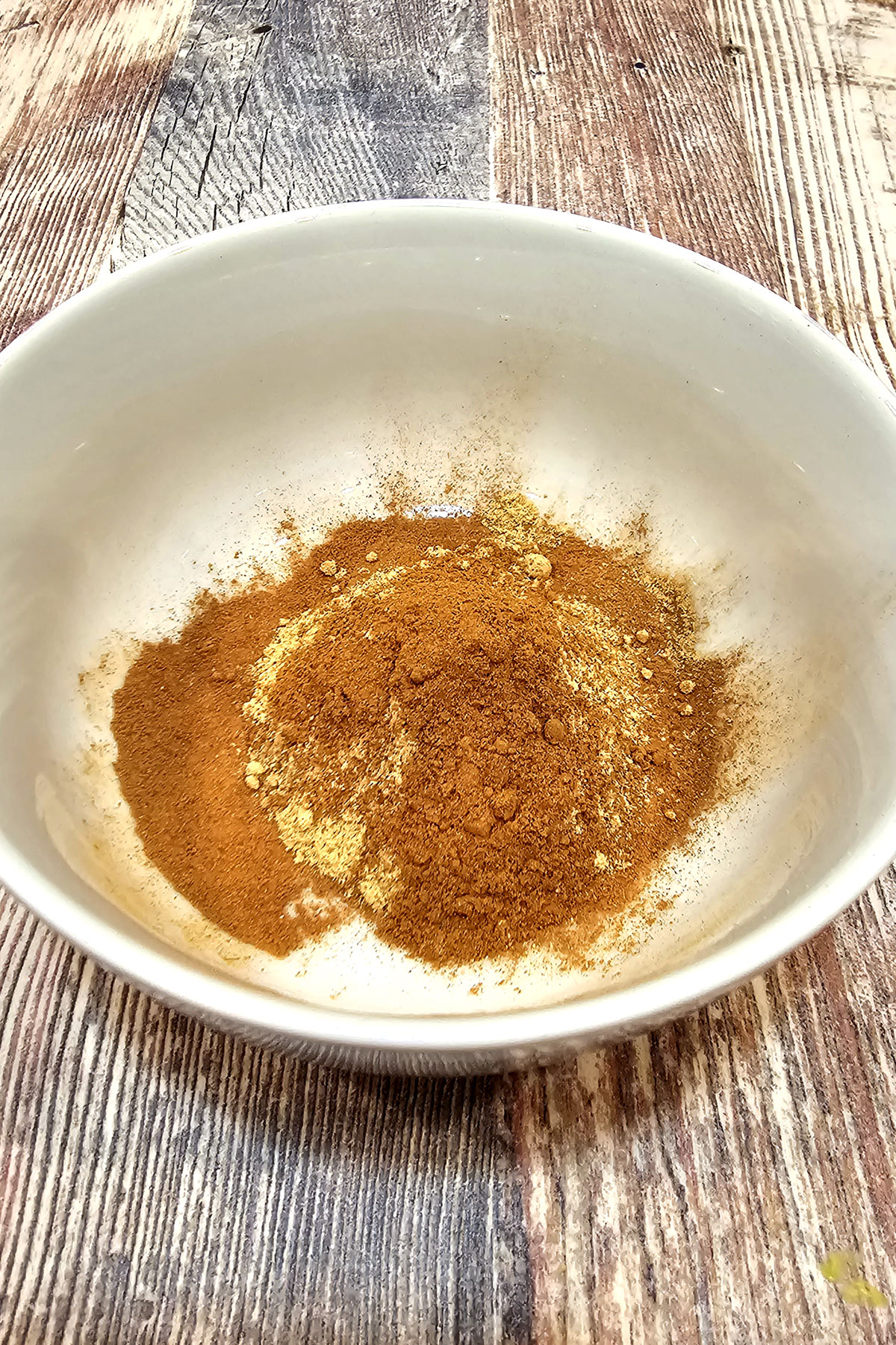 pumpkin spice mix in a white bowl.