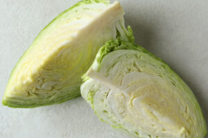 photo of 2 cabbage wedges on a white background.