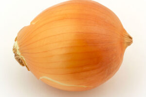 photo of a yellow onion bulb on a white background.