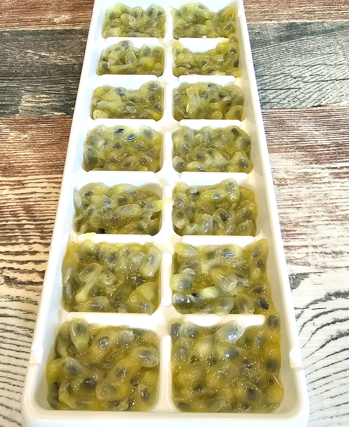 ice cube tray full of maypop pulp