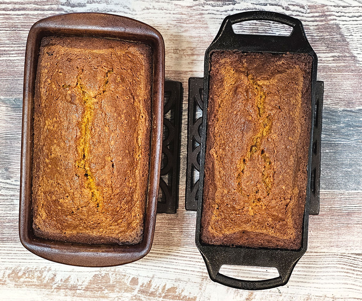 2 loaves of butternut squash quick bread cooling in their loaf pans after baking.